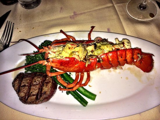 Knife and Fork Inn signature dishes Lobster Thermidor, Prime Steaks (e.g., New York Strip, Filet Mignon), Oysters Rockefeller, Clams Casino, Veal Oscar.